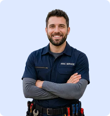 Smiling HVAC technician with beard, arms crossed, wearing navy service uniform with tool belt.
